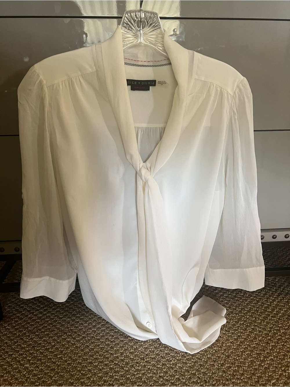 95 % silk . Yummy Alice + Olivia employed. Tie-Neck Semi-Sheer Blouse